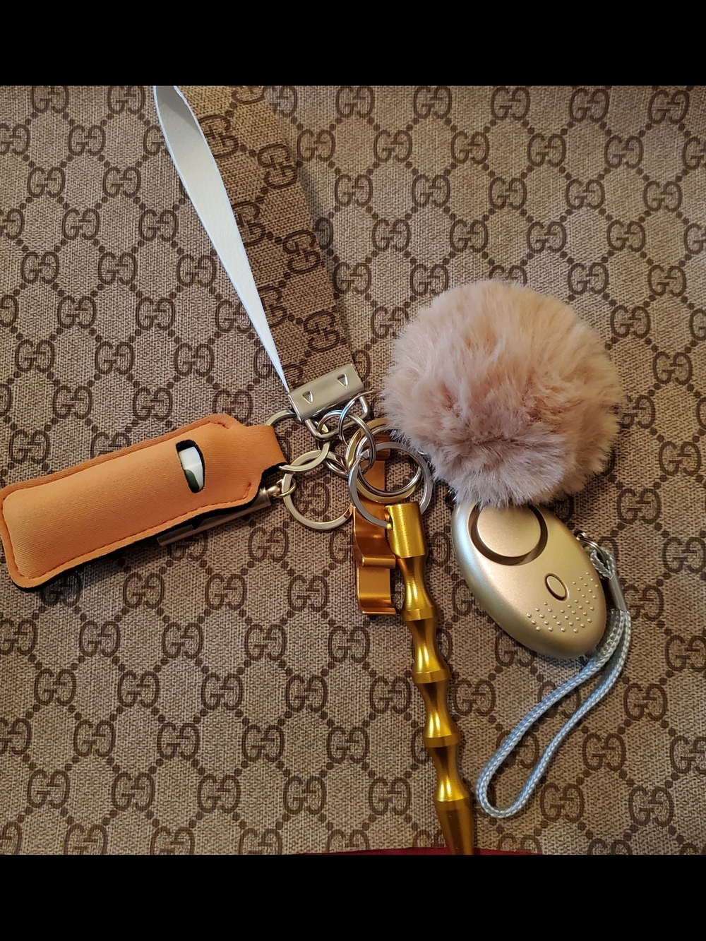 Gucci Tan Pom Pom & Gold Tone Keychain Set